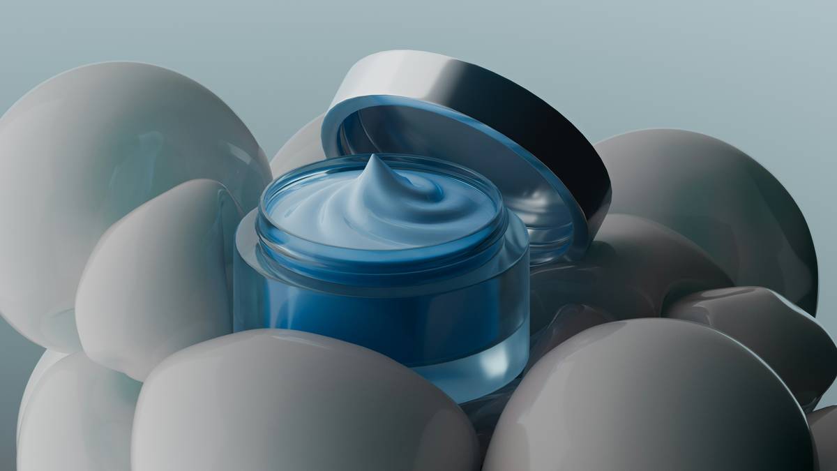 Cosmetic cream jar surrounded by spheres